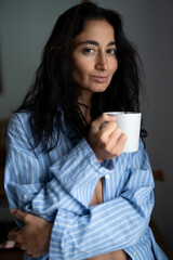 Cozy Morning Vibes with Coffee in Blue Striped Pajamas