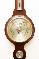 Close up of the face of an aneroid barometer