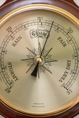 Close up of the face of an aneroid barometer