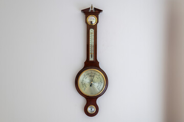 Close up of the face of an aneroid barometer