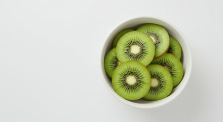 Fresh kiwi pieces arranged in a minimalistic fruit composition, perfect for health themes.
