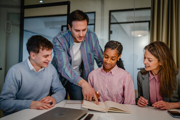 male director teach and help to his colleagues with new project