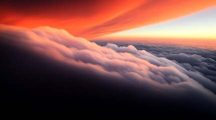 A breathtaking aerial view of vibrant orange and pink clouds at sunset above a serene horizon