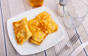 Appetizing pancakes with a filling of minced liver and eggs