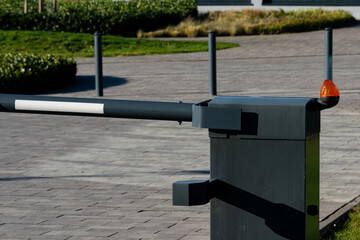 Barrier gate at an entrance in a modern outdoor setting