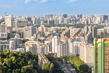 Fototapeta premium Modern developing residential district with tall skyscrapers and green park in the foreground, Singapore