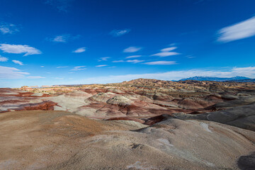 The colors of the otherworldly Bentonite Hills of Utah change and become more dramatic as the sun starts to set. As the sun nears setting at the blue hour the colors are the most beautiful.