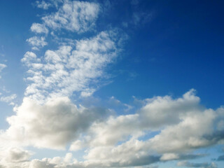 Fototapeta premium Warm cloudy blue sky. Nature background for design or sky replacement.