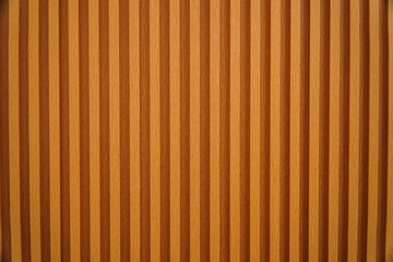 Obraz premium Close-up view of a wooden surface with vertical lines, showcasing the texture and detail of the wood. Textured Wooden Wall Paneling: A Detailed Close-up