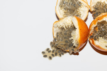 Open Granadilla Fruits with Seeds on White Background
