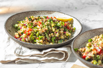 Buckwheat tabbouleh salad. Traditional middle eastern or arab dish. Levantine vegetarian salad.