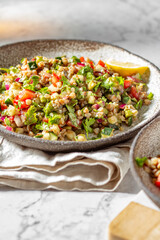 Buckwheat tabbouleh salad. Traditional middle eastern or arab dish. Levantine vegetarian salad.