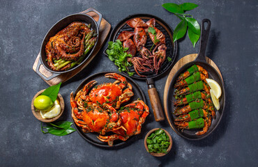 Seafood table with table with crabs, shrimps, octopus and squid. Top view