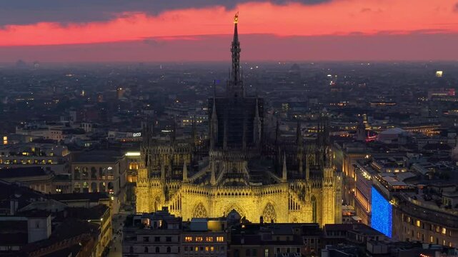 Aerial view of the central spire of the duomo and the city's cathedral at suset. Milan. Italy