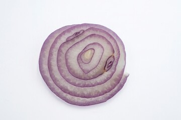 Fresh red onion rings on a white background, top view.
