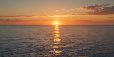 Obraz premium Stunning sunset over the ocean with vibrant colors reflecting on the water, creating a peaceful and serene atmosphere