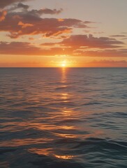 Fototapeta premium Tranquil sunset over the ocean with soft waves and warm colors, creating a serene and peaceful atmosphere for a perfect nature scene