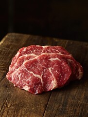 Close-up of a raw beef steak on wood surface