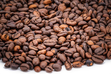 Heap of roasted coffee beans close-up
