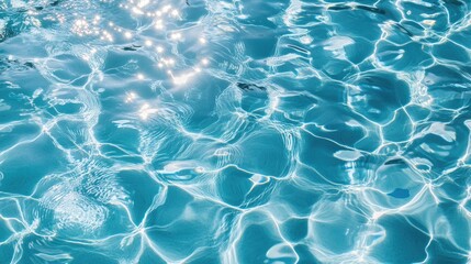 Obraz premium The captivating texture of pool water on a sunny day unfolds in a high-angle view, with ripples and reflections forming a serene, artistic pattern.