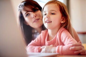 Laptop, elearning and mother with kid in house for online education app, kindergarten student and creative phonic skills. Child development, teaching and helping with woman and girl in family home