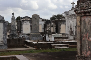 Fototapeta premium Historic cemeteries of New Orleans with above-ground tombs and wall vaults