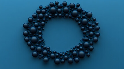 Obraz premium A dark, moody circular arrangement of black beads on a calm blue background, highlighting their contrast.