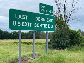 A road sign, in English and French advised drivers they are approaching the last US exit before the...