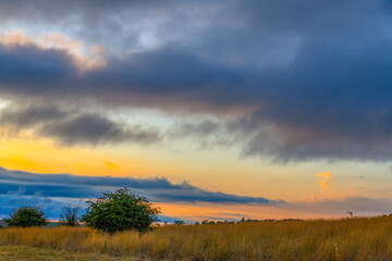 Sunset views over rural farmland with clouds