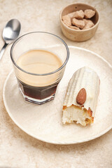 Enjoy a delightful pairing of rich coffee and sweet, flaky pastry, perfect for any leisurely afternoon
