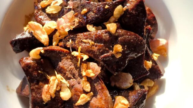 Fried pork liver in plate, in door  Chiangmai  Thailand 