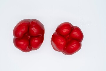 Juicy red sweet bell pepper close-up on a white background. Healthy eating. © Olha