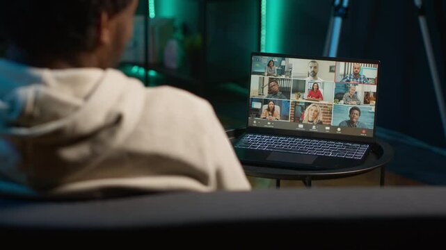 Smiling black man hosting a virtual family meeting online via video conference, meeting with the relatives and sharing latest news. Person uses web connection to chat with loved ones. Camera A.