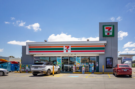 The exterior of a 7-Eleven convenience store with branding and signage in a suburban neighborhood in Tarneit, Australia.