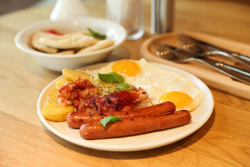 Delicious breakfast served on wooden table in restaurant, closeup