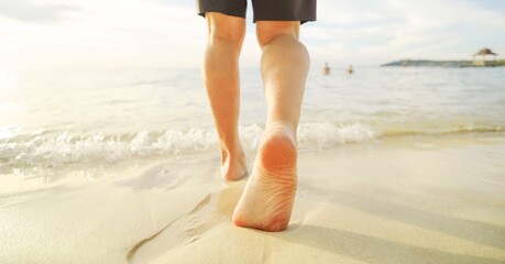 person walking on the beach