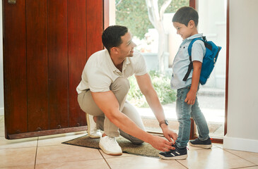Happy father, tying shoes and school with son by door for morning preparation or getting ready at home. Dad, child or tie laces with kid for education, learning journey or first day at preschool