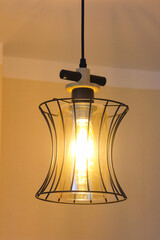 Orange bulb hanging on the wall