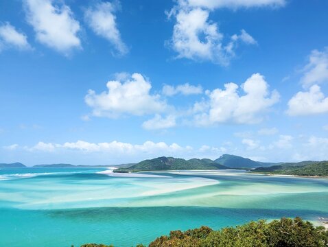 Hill Inlet Lookout in the Whitsundays with very white sand and multi-colored aqua and blue swirling water