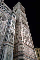 Fototapeta premium Majestic Giotto's Campanile standing tall against the night sky in Florence, Italy, a breathtaking view.