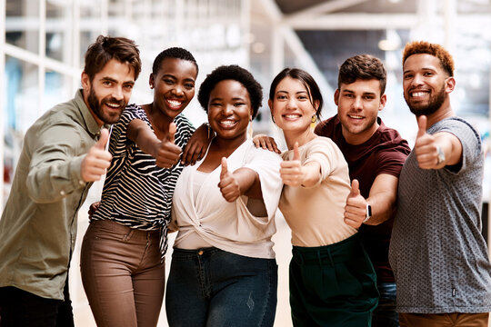 Creative, team or thumbs up of success achievement, portrait or employee engagement in startup. Internship, diversity opportunity or happy people with like, review or support vote in company feedback - Powered by Adobe