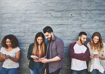 Wall, outdoor or happy people with phone or tablet for gossip, online update or news in urban town....
