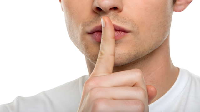 person with finger on lips