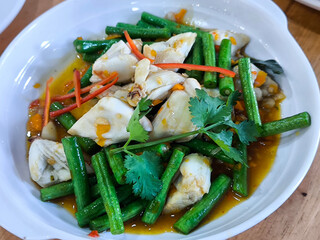 Stir-Fried Fish with Long Beans Thai style on Dish and wooden background