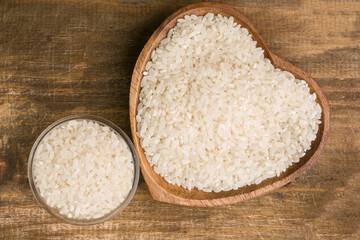 bowl of rice on wooden background