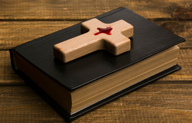 bible book with cross in blood