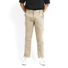 A man poses confidently in beige trousers and a black shirt, highlighting contemporary fashion in a simple, uncluttered backdrop