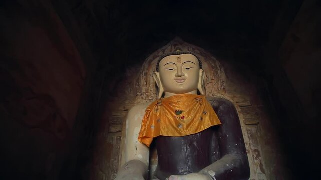 A detailed view of ancient wall art at Ananda Temple in Bagan, Myanmar, depicting a Yidam or Buddha figure. A beautiful display of traditional Buddhist artistry and history.