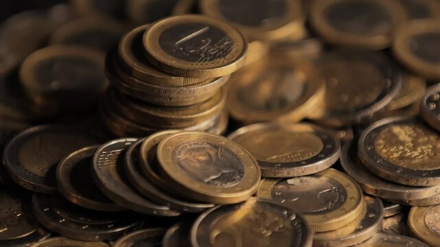 Closeup shot of piles of euro coins stacked up.