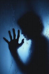 Haunting Silhouette of Woman Behind Frosted Glass with Blurry Hands and Body in Eerie Blue Light